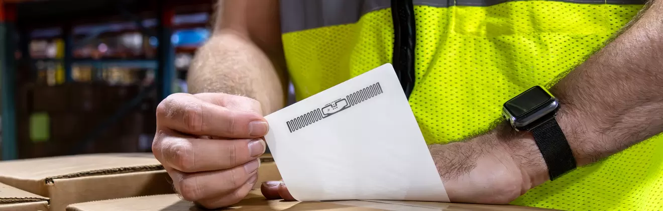 logistics employee placing the label